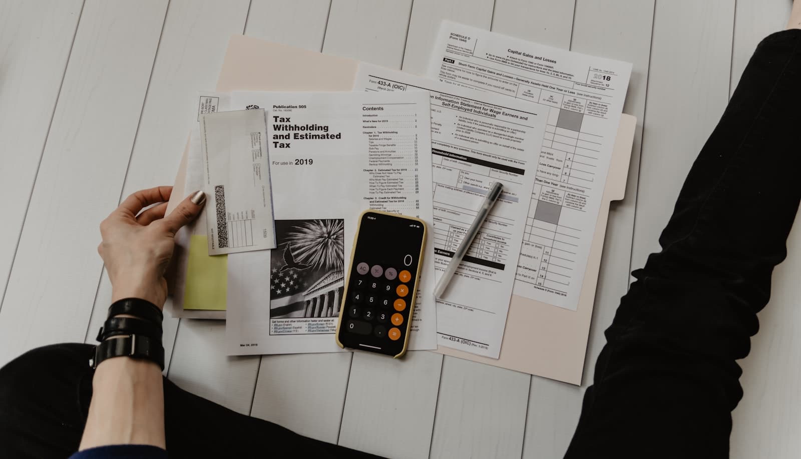 Finance professional reviewing payroll reports and calculations